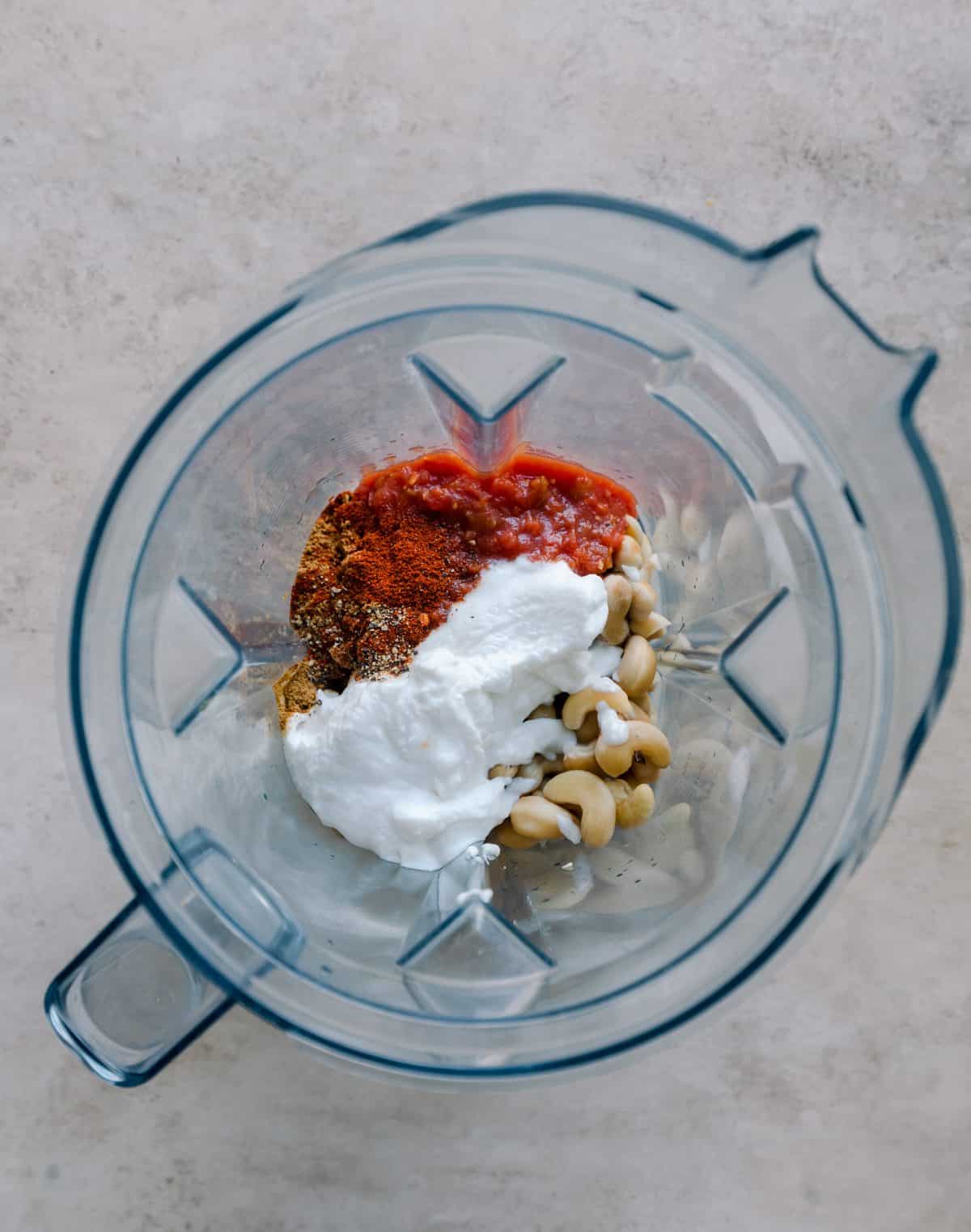 cashews, salsa, yogurt, and spices in blender.