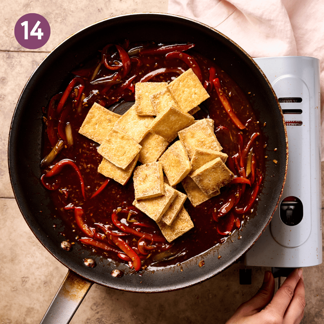 Golden brown tofu added to pan.