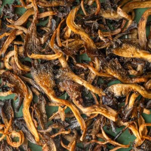 close up of crispy mushrooms on a baking tray.